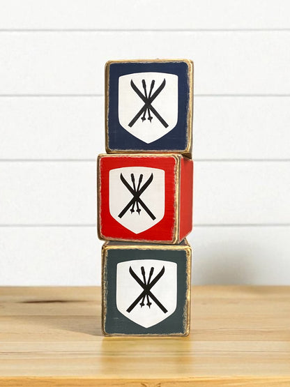 Rustic ski tissue boxes featuring three handmade wooden covers stacked together, each with vintage-style crossed skis and poles—perfect for ski lodge, mountain cabin, or winter chalet décor, handmade in Maine