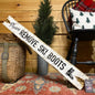 Vintage-style white “Please Remove Ski Boots” wooden sign with retro ski boot graphic, handmade in Maine — rustic ski lodge and mountain cabin wall décor for mudroom or entryway, handcrafted alpine ski house decoration, made in Maine