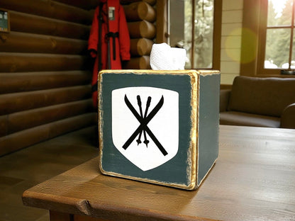 Rustic handmade ski tissue box for ski lodge or mountain cabin décor, featuring crossed skis and winter alpine design, perfect for ski house or chalet bathroom, handmade in Maine.