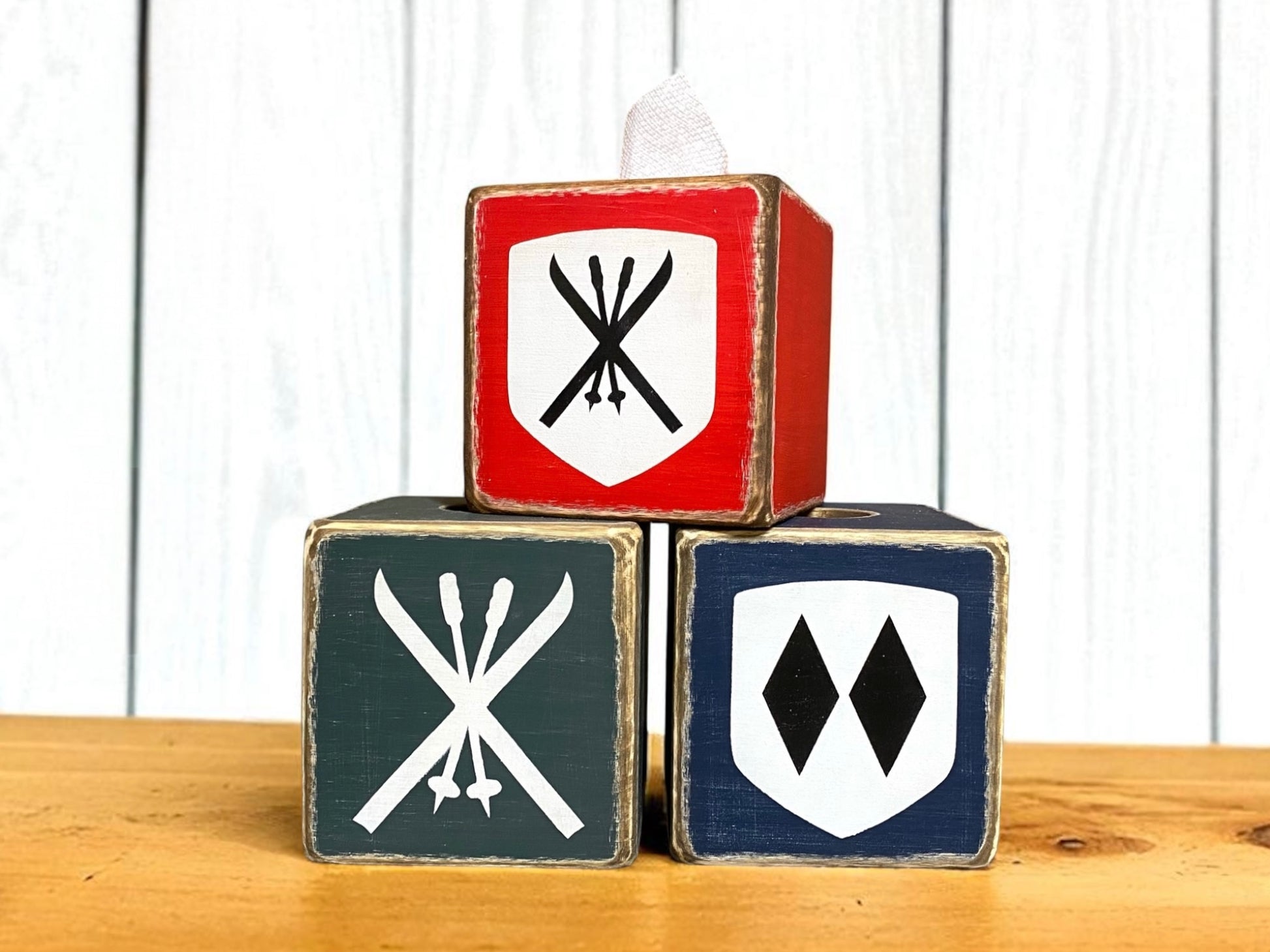 Rustic ski lodge tissue box set with vintage ski and mountain emblems, handcrafted wood covers in red, navy, and gray — cozy cabin decor and perfect ski lover gift, handmade in Maine