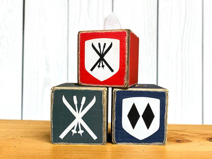 Rustic ski lodge tissue box set with vintage ski and mountain emblems, handcrafted wood covers in red, navy, and gray — cozy cabin decor and perfect ski lover gift, handmade in Maine
