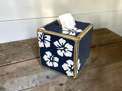 Close-up of decorative navy hibiscus tissue box cover featuring tropical floral artwork and coastal beach house style. Handcrafted decor for tropical bathrooms, guest rooms, seaside cottages, and waterfront homes