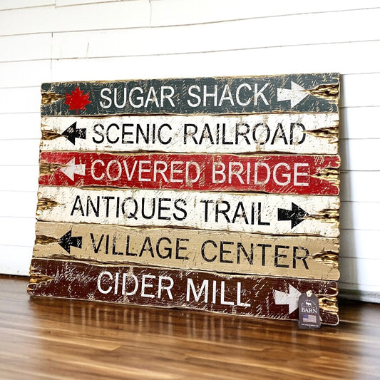 Rustic wooden signs with arrows to Sugar Shack, Scenic Railroad, Covered Bridge, Antiques Trail, Village Center, and Cider Mill, handcrafted distressed farmhouse and cabin decor by The Unpolished Barn LLC.