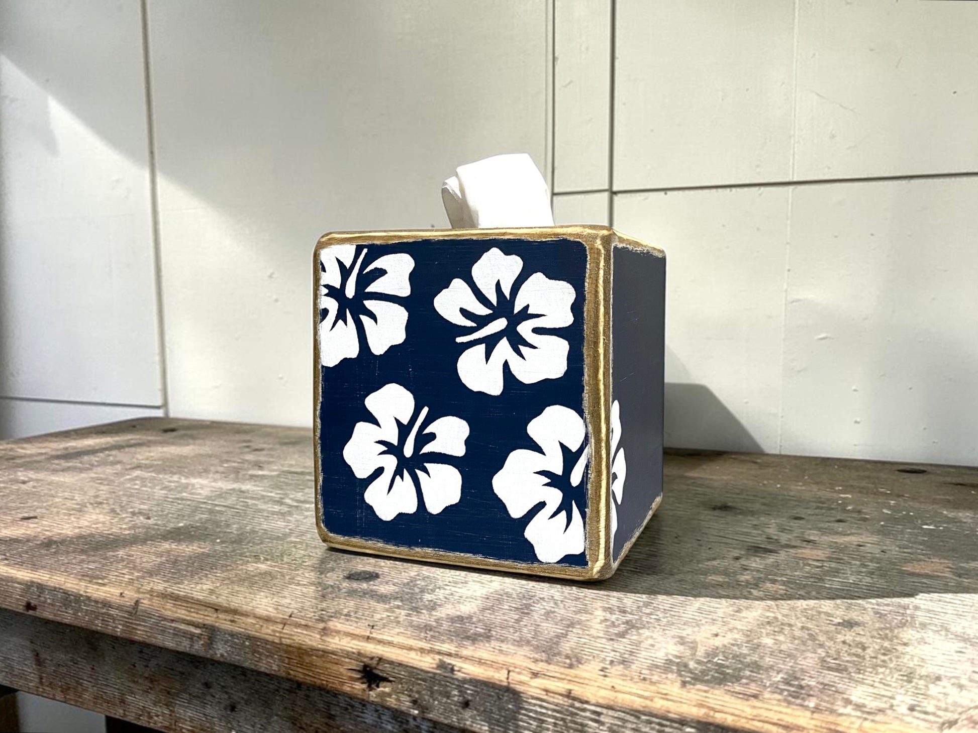 Decorative tropical hibiscus tissue box cover featuring a navy blue floral design. Coastal beach house decor for tropical bathrooms, guest rooms, beach cottages, waterfront homes, vacation rentals, and seaside retreats