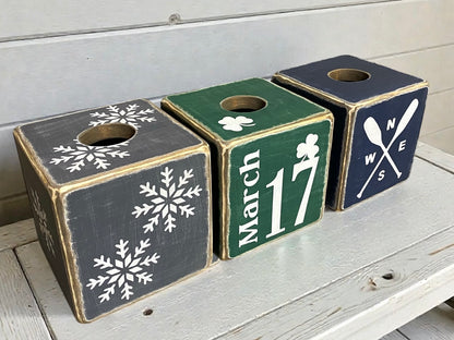 Group of rustic St. Patrick’s Day and winter-themed tissue box covers, including green shamrock and white March 17 designs, hand-distressed wood finish, styled for cabins, lodges, lake houses, and farmhouse décor, perfect for holiday and seasonal home accents, made in Maine