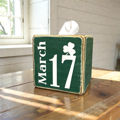 Green St. Patrick’s Day tissue box cover with March 17 lettering, shown in a cozy cabin setting, hand-distressed wood finish, rustic Irish décor for lodges, lake houses, or farmhouse, festive holiday accent, made in Maine