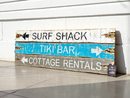 Hand-painted beach cottage sign with distressed arrows to Surf Shack, Tiki Bar, and Cottage Rentals, rustic coastal wall decor by The Unpolished Barn LLC