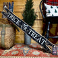 Rustic wooden Trick or Treat sign, distressed for a vintage farmhouse look. Handmade Halloween wall decor by The Unpolished Barn, perfect for spooky fall home decorating