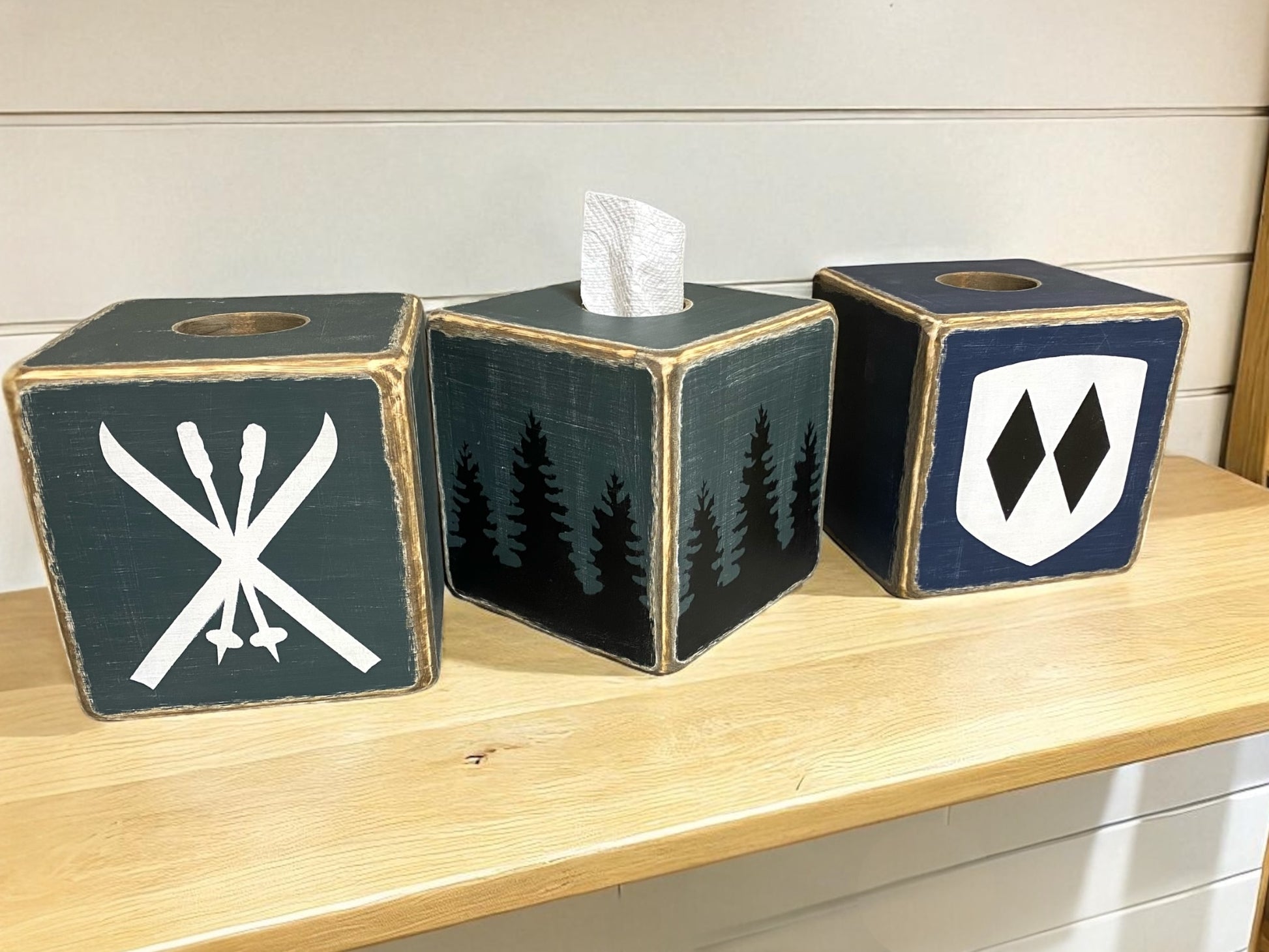 Rustic ski lodge tissue box covers with pine tree forest design, skis and poles crossed and double diamond. Made to be distressed wood great for lodge decor, cozy mountain cabin or woodland home style.