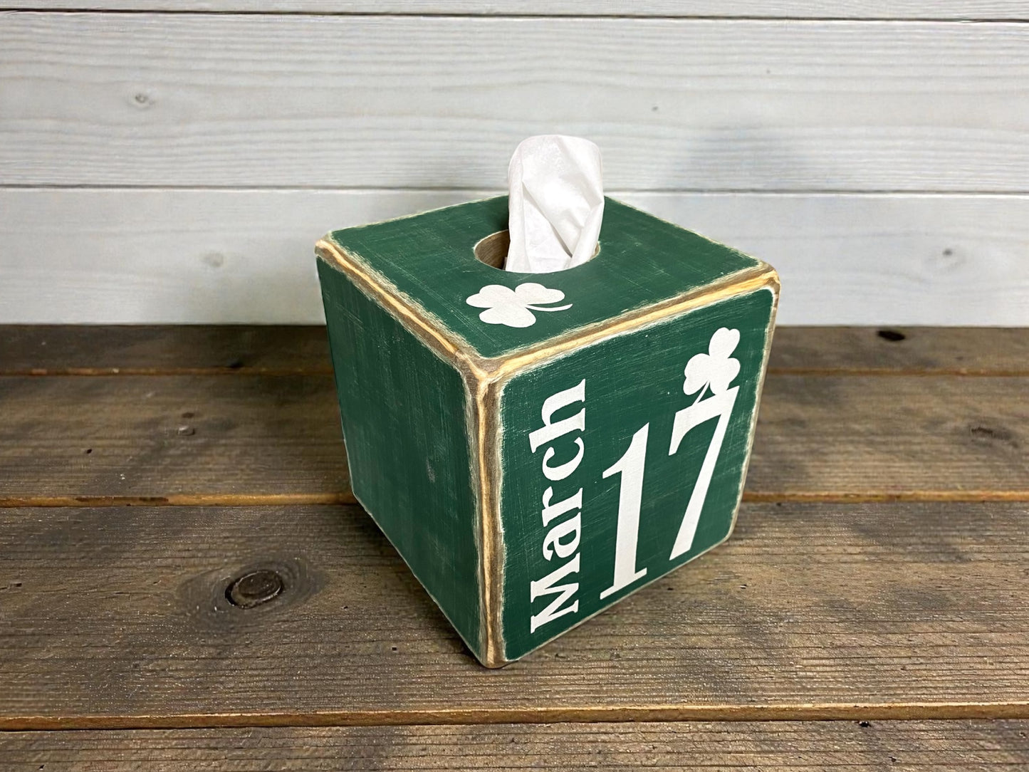 Top view of green St. Patrick’s Day tissue box cover with hand-distressed wood finish, styled for rustic cabin, lodge, lake house, or farmhouse décor, showcasing shamrock and March 17 design