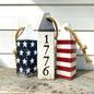 Decorative 1776 American flag wood buoy set featuring patriotic red, white, and blue details with a distressed finish. Nautical Americana decor for beach houses, coastal cottages, patriotic homes, waterfront spaces, and Americana rooms