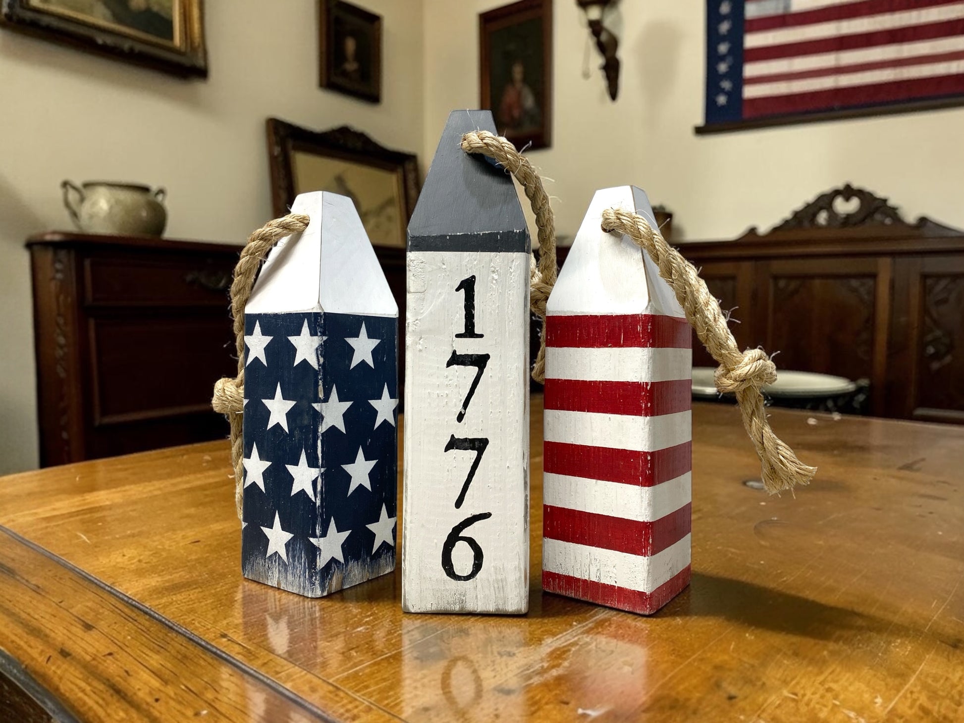 Decorative American flag buoy set displayed in a coastal home with nautical Americana decor. Perfect for coastal cottages, beach homes, patriotic decor spaces, and waterfront living areas