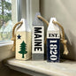Decorative Maine wood buoy set featuring the original Maine flag design and established date details. Rustic nautical coastal decor for Maine homes, beach houses, cottages, harbors, and waterfront spaces.