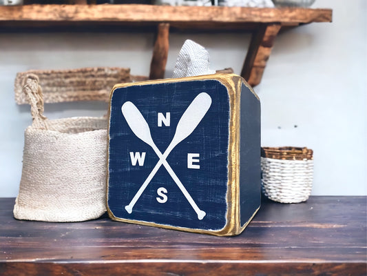 Canoe paddle with compass tissue box