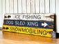 ice fishing and dog sledding signs