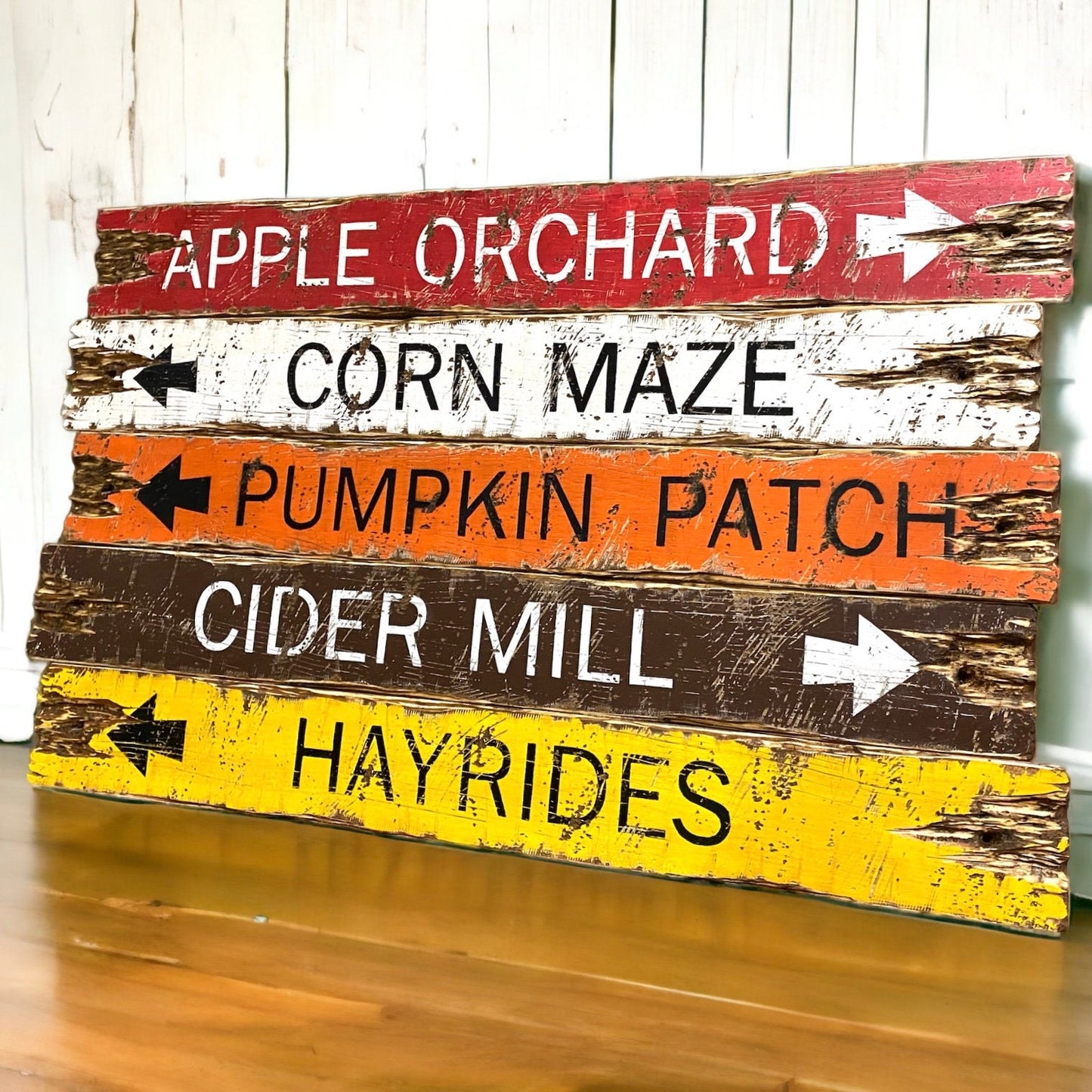 Rustic fall directional sign set featuring “Apple Orchard,” “Corn Maze,” “Pumpkin Patch,” “Cider Mill,” and “Hayrides.” Hand-painted in warm autumn tones of red, white, orange, brown, and yellow with distressed farmhouse charm. Perfect for cozy cabin, lodge, or harvest-season decor. Each sign is handmade in Maine with our signature rustic finish.