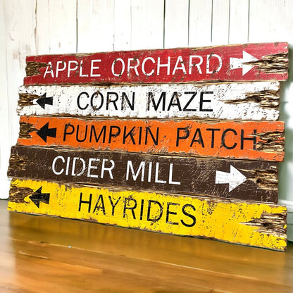 Rustic fall directional sign set featuring “Apple Orchard,” “Corn Maze,” “Pumpkin Patch,” “Cider Mill,” and “Hayrides.” Hand-painted in warm autumn tones of red, white, orange, brown, and yellow with distressed farmhouse charm. Perfect for cozy cabin, lodge, or harvest-season decor. Each sign is handmade in Maine with our signature rustic finish.
