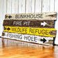 Hand-painted rustic cabin and lodge sign with “Bunkhouse, Fire Pit, Wildlife Refuge, Fishing Hole” — vintage camp wall art and outdoor retreat décor, handmade in Maine