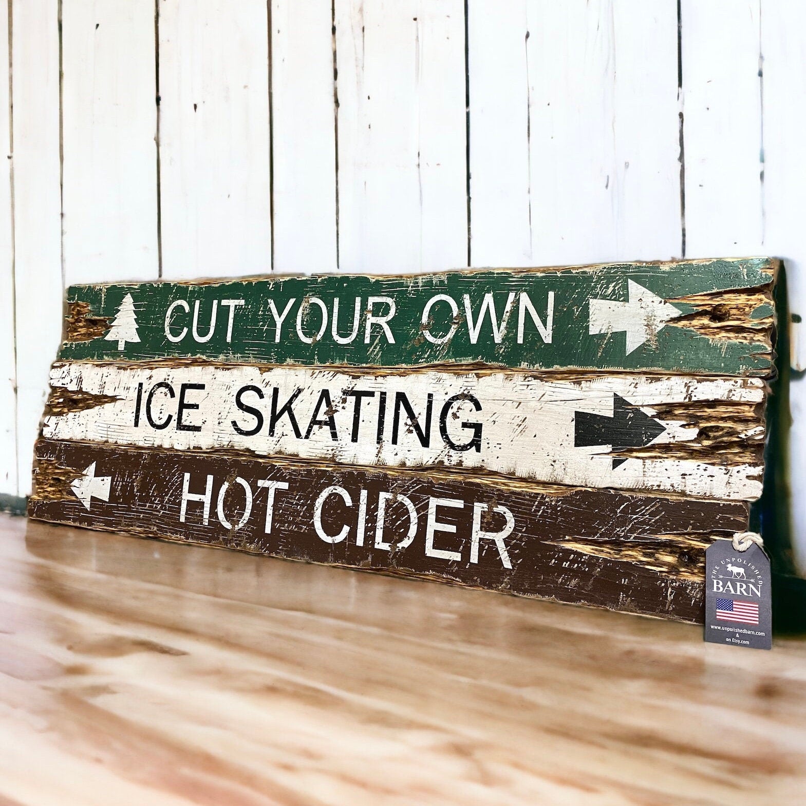 Rustic farmhouse and cabin sign handmade in Maine with distressed wood planks reading “Cut Your Own,” “Ice Skating,” and “Hot Cider,” perfect for cozy lodge decor, winter cabins, and holiday farmhouse style