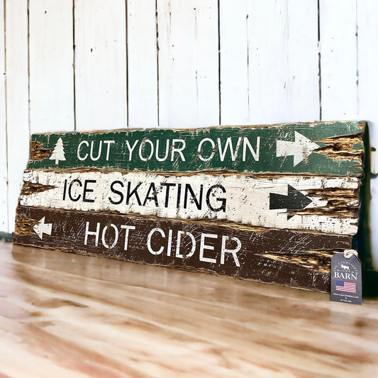 Rustic farmhouse and cabin sign handmade in Maine with distressed wood planks reading “Cut Your Own,” “Ice Skating,” and “Hot Cider,” perfect for cozy lodge decor, winter cabins, and holiday farmhouse style