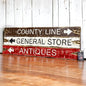 Rustic directional wood sign set reading “County Line,” “General Store,” and “Antiques,” in distressed brown, cream, and red paint, handcrafted farmhouse wall decor handmade in Maine by The Unpolished Barn LLC.
